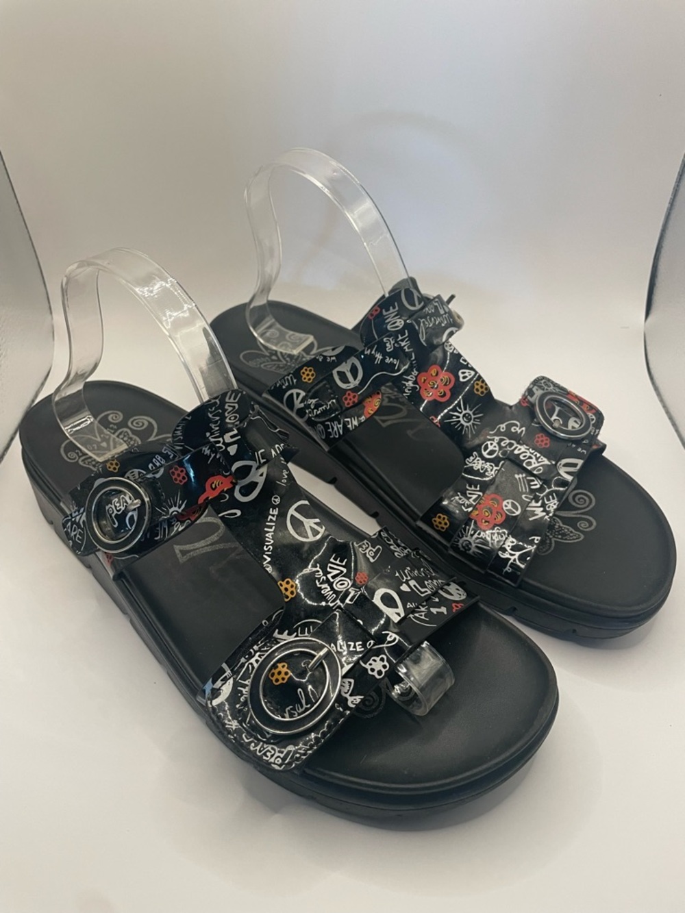 Women’s ALGRIA black graphic sandals.
Goes with everything! Cute, funky,Size 11